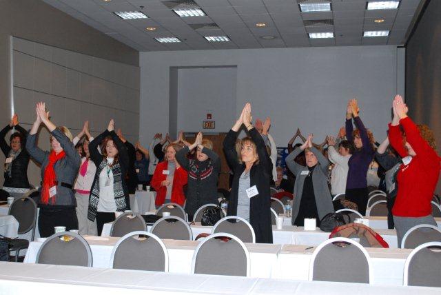 CCC-EAPA attendees practice chair
                        yoga